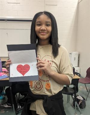 Student displays card she made.
